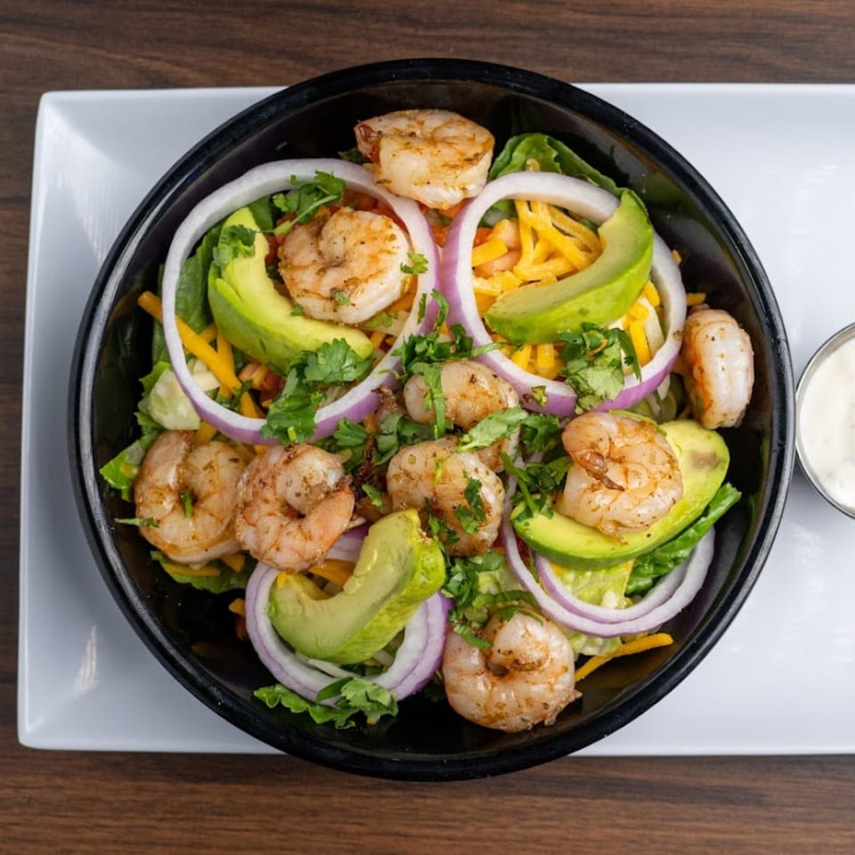 Habaneros Fresh Mexican Grill's shrimp salad with avocado, red onion, cheese, and cilantro.
