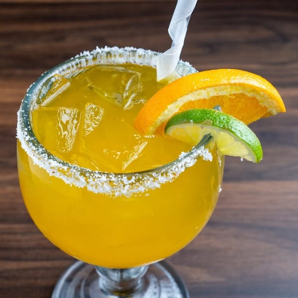 Habaneros Fresh Mexican Grill's margarita with a salted rim, orange slice, and lime wedge.